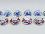 a set of six blue and white cups and saucers