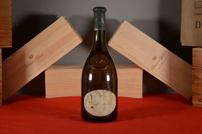 a bottle of wine that is sitting on a table