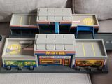 a lot of toy vehicles that are sitting on a couch