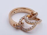 an image of a gold ring with diamonds on a white surface