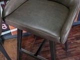 two chairs that are sitting in front of a counter