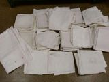 a pile of white napkins sitting on a table