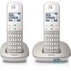 deux téléphones filaires posés côte à côte sur une surface blanche