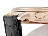 a close up of a wrist watch with a black strap