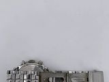 a close up of a wrist watch on a white surface