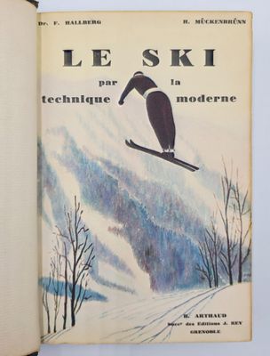 un livre sur lequel figure la photo d'une personne à skis dans la neige
