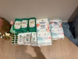a lot of toilet paper and other items on the floor