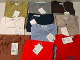 a lot of men ' s t - shirts on display in a store