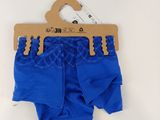 baby boy ' s blue diaper pants with a wooden hanger on a white background