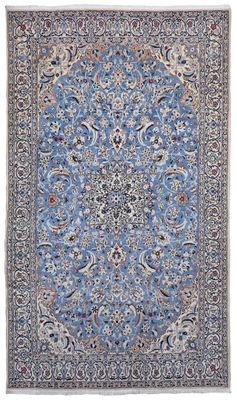 a blue rug with a medallion design on it