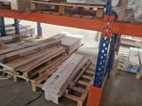 many pallets of wood on the shelves in the warehouse