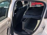 a car with the door open and the seat down