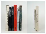two books that are sitting next to each other on a shelf