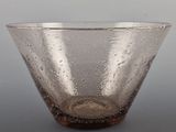 a close up of a glass bowl with water droplets on it