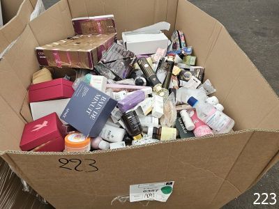 a cardboard box full of cosmetics products on the street