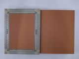 an open book with a brown cover sitting on top of a white table
