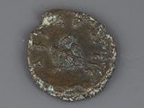 an old coin with a bird on it sitting on top of a table