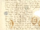 un gros plan d'un morceau de papier sur lequel on a écrit