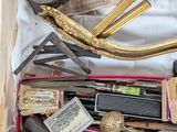 a box filled with various items that include scissors, scissors and other items