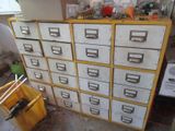 yellow and white filing cabinet with lots of drawers in a room