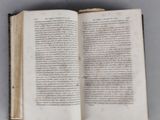 an open book that is sitting on a table