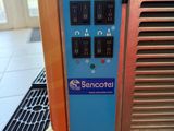 a machine that is sitting on the floor next to a window