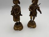 paire de figurines anciennes en bronze représentant un homme et une femme