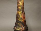 a vase that has a picture of a tree on it