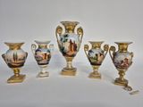 five vases that are sitting on a table