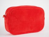 a red toilet bag sitting on top of a white surface