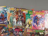 a lot of comic books sitting on a table