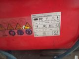 an image of a red tank with a sticker on it