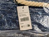 a close up of a handbag with a tag on it