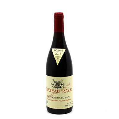 a bottle of red wine sitting on top of a white table