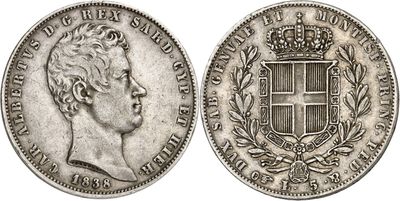 a silver coin with a crown on top of it