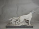 statue of a dog and a cat on a white background