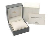 a box with a ring inside of it on a white surface