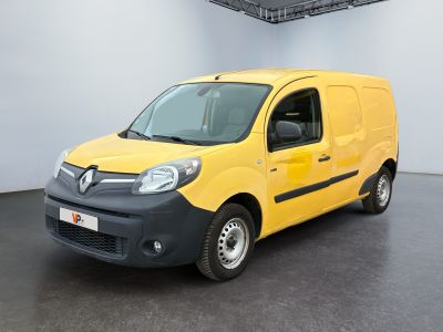 the small yellow van is parked in a large room