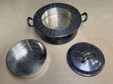 a metal container with a lid and a metal container with a lid