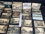 a lot of old black and white pictures on the table