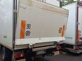two trucks that are parked next to each other