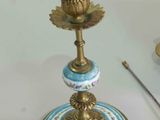 two candles that are sitting on a table next to each other