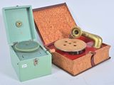an old record player in a suitcase next to an old record player