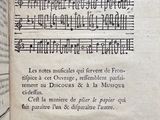 an old book with a page of music written in it