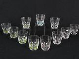 a group of glasses sitting on top of a table next to each other