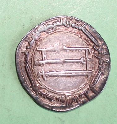 an old silver coin with a picture of a man on it