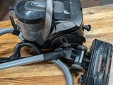 a vacuum that is sitting on a wooden table