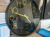 a clock that is sitting on a table in front of a map