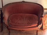 a red couch that is sitting in a room