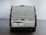 a small van that is parked in a room